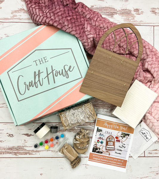 Our January Craft At Home Box featured a farmhouse window cut out that can alternate as an everyday calendar or a countdown calendar! The gifts this month included the softest blanket and a task pad to help kick your 2023 in high gear!